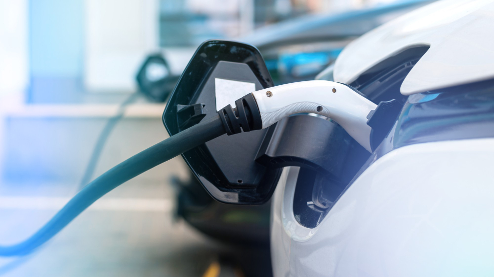 plugged chargers into two electric cars charge station E3 Lithium Announces New Advisory Committee, Designed to Propel Future Growth