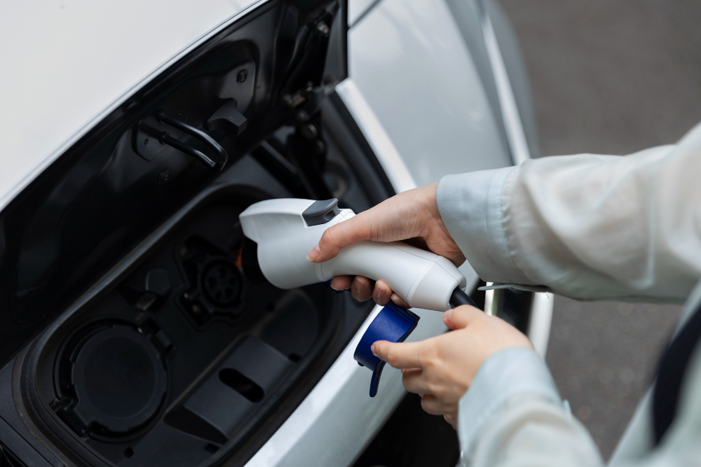 woman charging her electric car station 1 E3 Lithium to Present at Upcoming Conferences